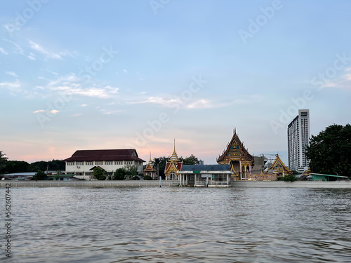 Wat Bang Pho Omawat, buddhist temple on Chao Phraya River, Bangkok, Thailand. วัดบางโพโอมาวาส Monastery located on the left bank. กรุงเทพมหานคร Beautiful pink sunset in Krung Thep Maha Nakhon, Thai 