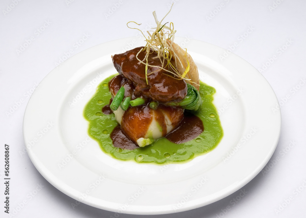 Roast duck breast on mashed potato, green beans and a pea puree and a pastry mille feuille.