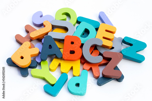 Colorful wooden alphabets on white background.