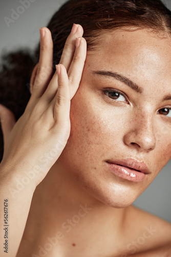 Skin, beauty and black woman portrait with skincare glow from spa treatment and makeup. Model, hand and face of a person relax after dermatology detox in a studio with gray background feeling healthy