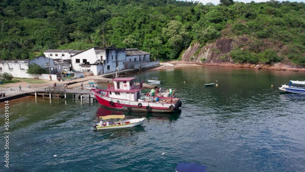 Labors Loading Trash In Garbage Boat Anchored At ilha Grande Island, Rio de Janeiro, Brazil Labors Loading Trash In Garbage Boat Anchored At ilha Grande Island, Rio de Janeiro, Brazil