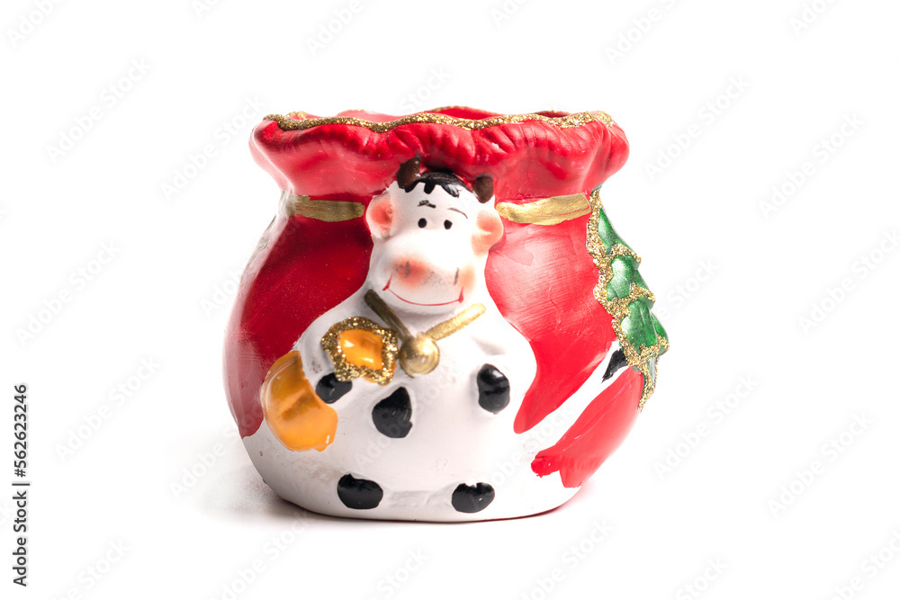 Ceramic toy cow isolated on a white background Ceramic toy cow isolated on a white background