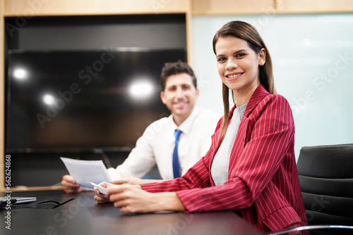 Smiling businesspeople having a discussion in an office