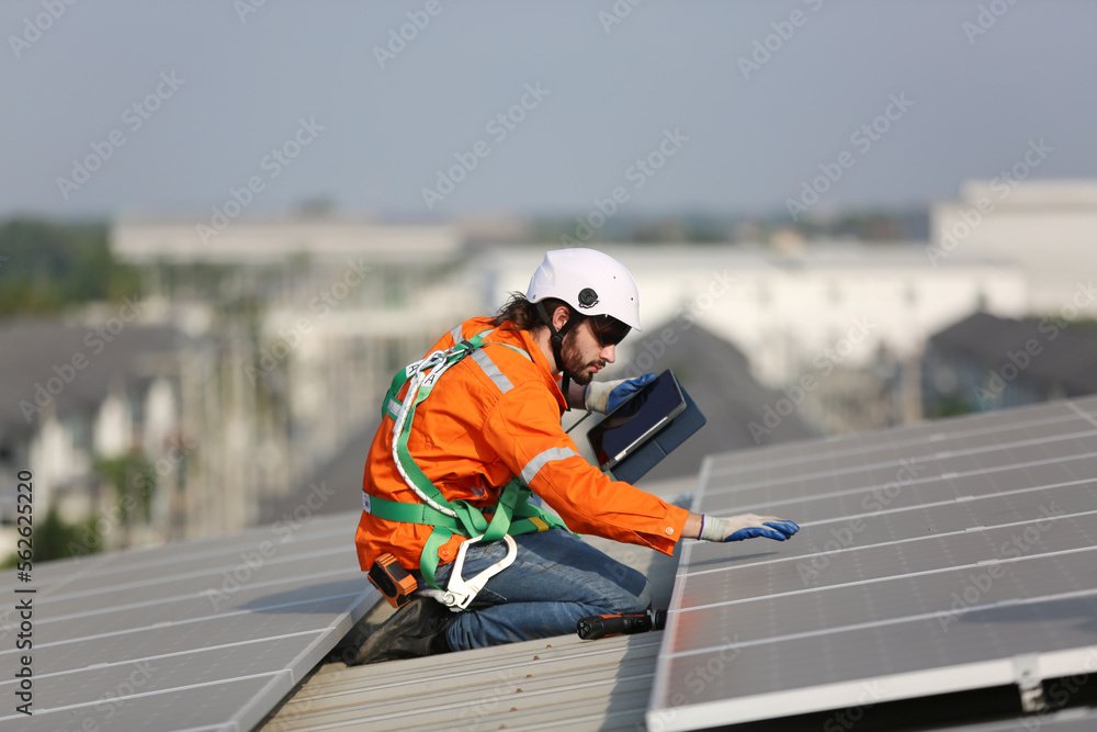 Professional worker installing solar panels on the roof. engineer working on checking equipment in solar power plant, Pure energy, Renewable energy. Professional worker installing solar panels on the roof. engineer working on checking equipment in solar power plant, Pure energy, Renewable energy.