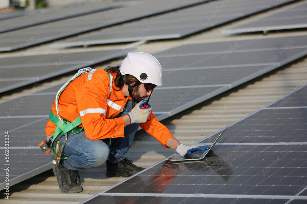 Professional worker installing solar panels on the roof. engineer working on checking equipment in solar power plant, Pure energy, Renewable energy.