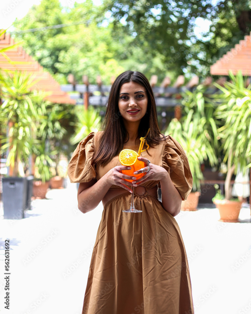 Fototapeta premium Travel, coffee, leisure, lifestyle and people concept -beautiful lady in a restaurant. portrait of a beautiful young woman 