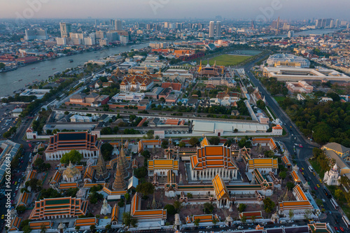 Aerial view Day to Night of Chao Phraya River with Royal Grand Palace and Emerald Buddha Temple Landmark of Bangkok  Thailand. Amazing Drone Footage over the City skyline in twilight.