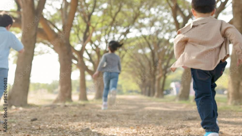 Happy children running in race outdoors at school Happy children running in race outdoors at school