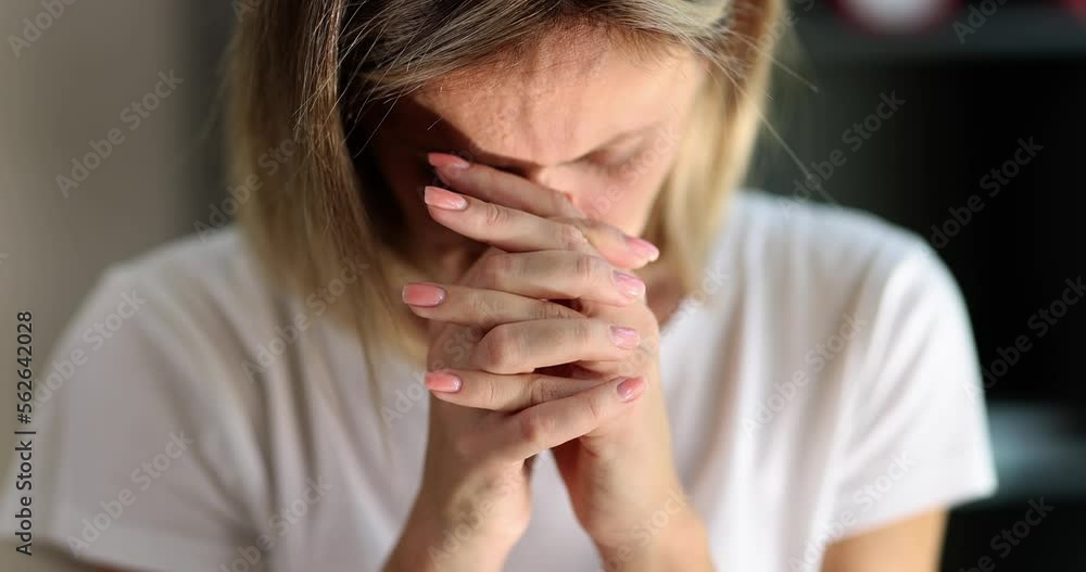Woman bowing her head and reading morning prayer 4k movie slow motion Woman bowing her head and reading morning prayer 4k movie slow motion