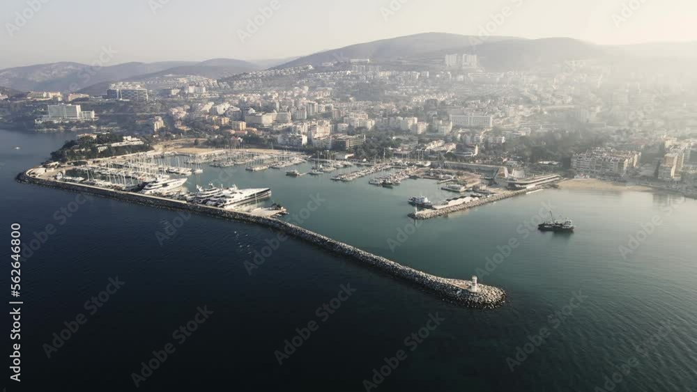 Panoramic View Of Kusadasi City Port On The Western Coast Of Turkey at Sunrise Light. Aerial Wide Shot Panoramic View Of Kusadasi City Port On The Western Coast Of Turkey at Sunrise Light. Aerial Wide Shot