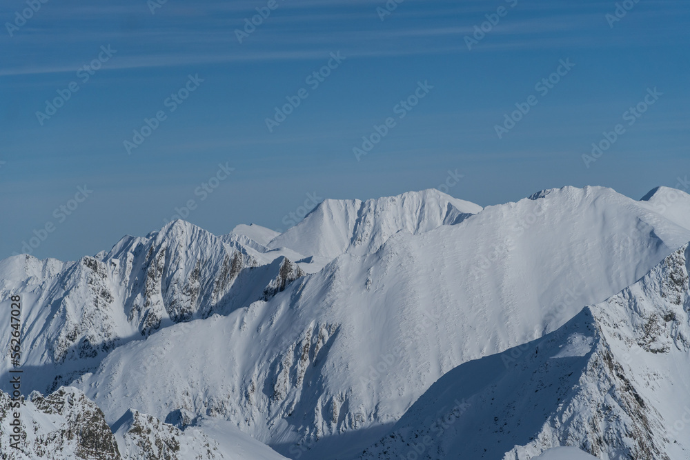 snow covered mountains,  Iezerul Caprei Peak, viewpoint to Moldoveanu Peak, Fagaras Mountains, Romania 