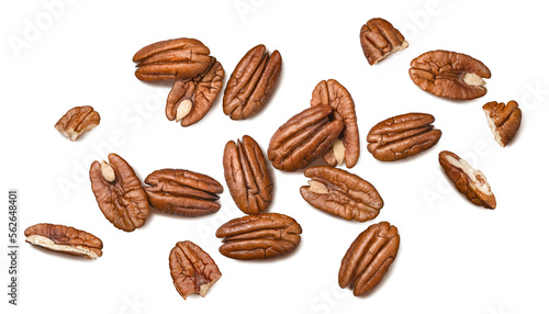Pecans isolated on white background. Nuts scattered. Top view.