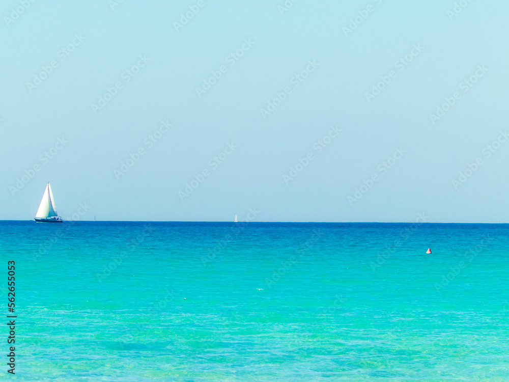 A boat in the turquoise waters of the Mediterranean Sea.