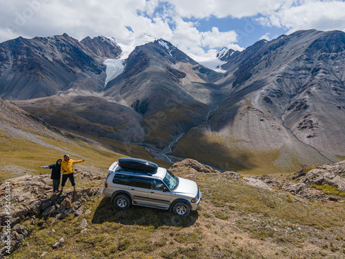 tourists by car on top of the mountain © Alexandr Vlassyuk