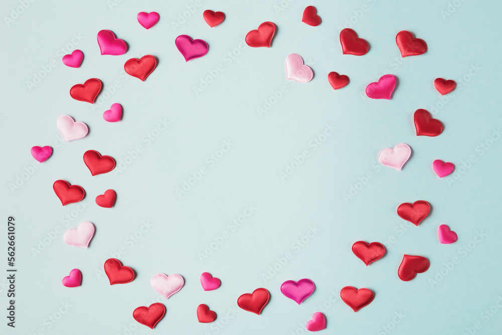 Valentine’s hearts on blue background with copy space. Valentines day greeting card template