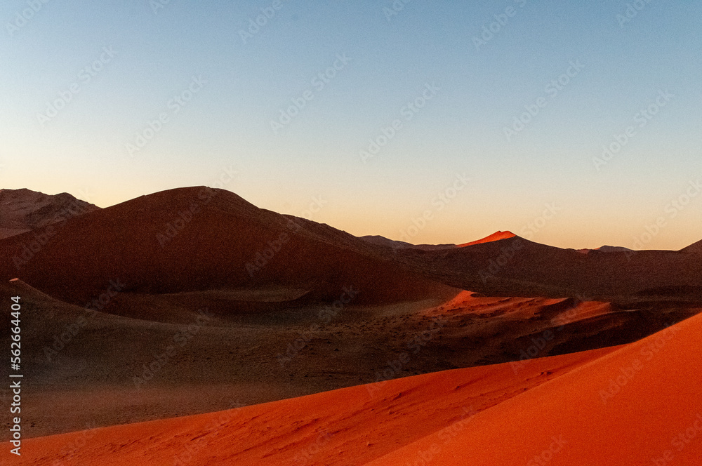 Exterior shot of the Namibian Sossusvlei sanddunes near the famous Dune 45 around sunrise Exterior shot of the Namibian Sossusvlei sanddunes near the famous Dune 45 around sunrise