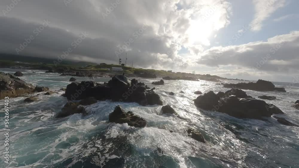 FPV drone shot flying above sea and rock in Rishiri Island Hokkaido Japan FPV drone shot flying above sea and rock in Rishiri Island Hokkaido Japan