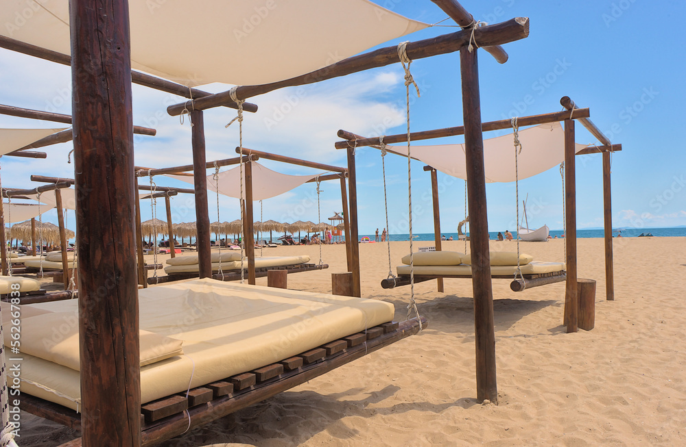 Sun loungers with sofas on a clean sandy beach. sea view with horizon, tranquility and relaxation. Inspirational beach resort Sun loungers with sofas on a clean sandy beach. sea view with horizon, tranquility and relaxation. Inspirational beach resort