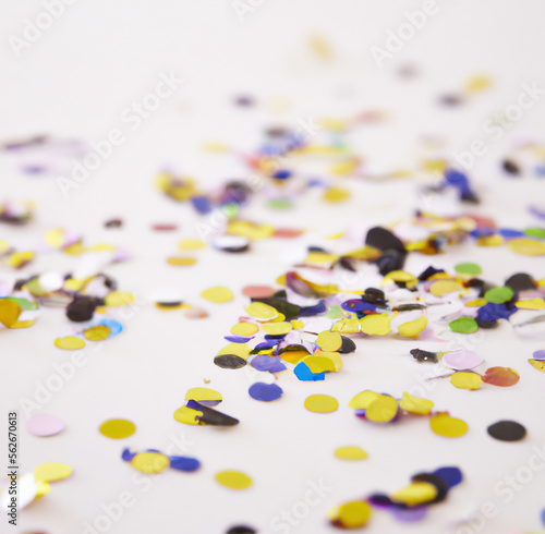 Close up of colorful confetti on white background created using Generative AI technology
