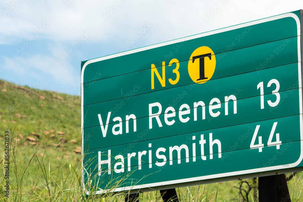 N3 national toll road or highway sign or signage with names Van Reenen and Harrismith and kilometres still to go concept travel and tourism in South Africa