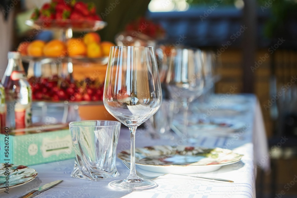 Crystal glasses for celebration, decorated for the holiday. Table setting. Crystal glasses for celebration, decorated for the holiday. Table setting.