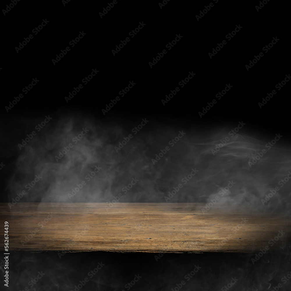 Dark empty wooden table with smoke float up on dark wall background. Free space for your decoration. Dark empty wooden table with smoke float up on dark wall background. Free space for your decoration.