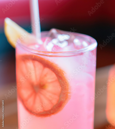 Close up of pink lemonade on black background created using generative ai technology