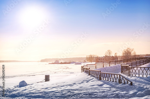 Fence on the embankment of the Volga River, a ship at the pier and the ruins of the Shuvalovs' estate, the city of Myshkin, Yaroslavl Region