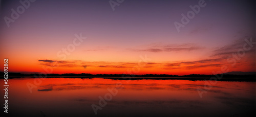 Reflective Red Sunset  generative AI © MichaelBastianelli