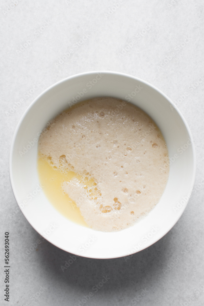 Activated yeast with water and melted butter, dry yeast granules on water, foamy yeast Activated yeast with water and melted butter, dry yeast granules on water, foamy yeast