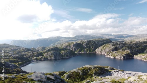Bright light lake surrounded by rocky hills