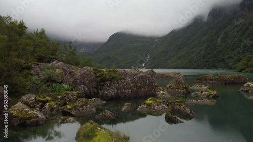 Mountain lake with waterfall
