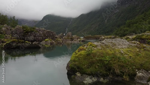 Lake in the mountains with big rocks in the water