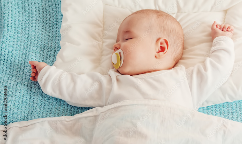 Cute three month old baby sleeping in comfortable bed. Cute three month old baby sleeping in comfortable bed.