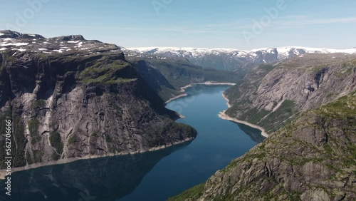 quiet flight over a fjord in norway with snow peak mountains