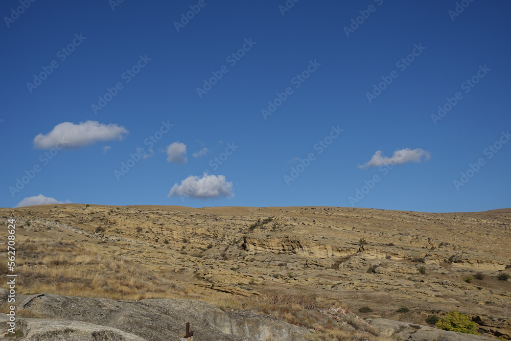 Unique landscape Archaeological site of the Uplistsikhe cave town fortress with beautiful sky Unique landscape Archaeological site of the Uplistsikhe cave town fortress with beautiful sky