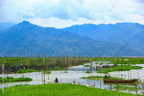 view of lake swamp pening and mountains. lake in the mountains photo