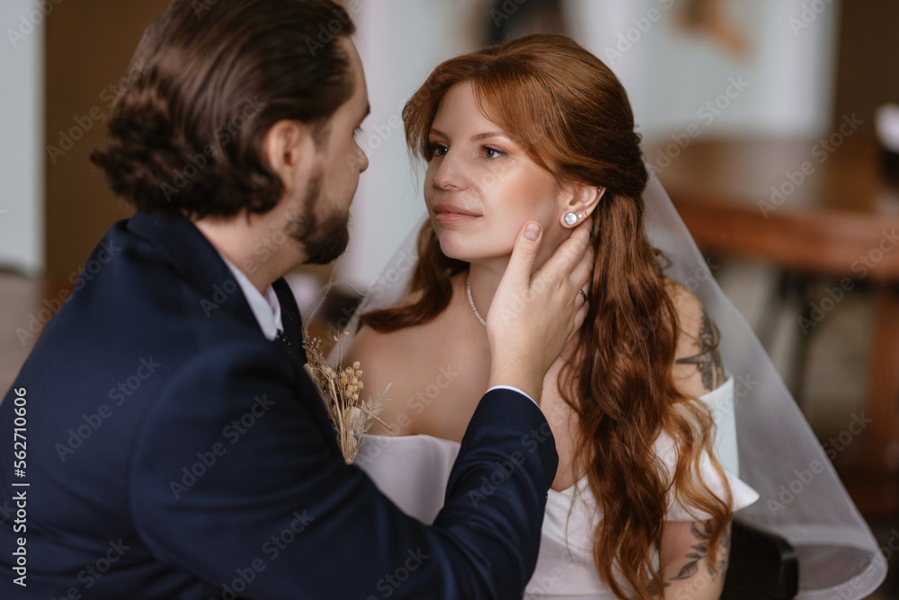 young couple bride and groom in a white dress young couple bride and groom in a white dress