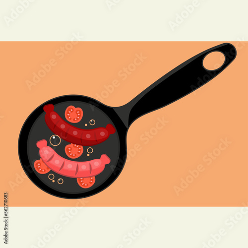 frying pan with sausages and tomatoes