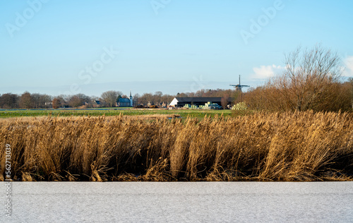 Winter landscape with frozen canal in Drenthe, Netherlands
 photo