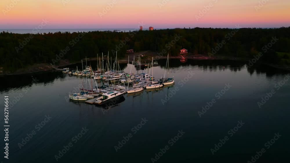 Aerial view around the Jussaari marina, summer dusk in Finland - orbit, drone shot Aerial view around the Jussaari marina, summer dusk in Finland - orbit, drone shot