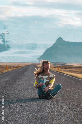 Road on Iceland, glacier, blond woman running, amazing view © milenie
