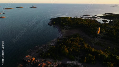 Aerial view around the iron beach on the Jussaari island, summer sunset in Raasepori, Finland - orbit, drone shot photo