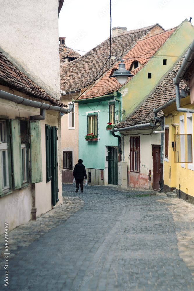 Medieval street and facade of historic buildings in city center of Sibiu Romania