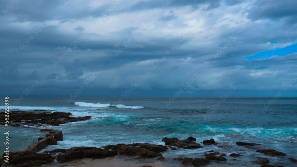 Tide pool at the Point, Mossel Bay under dark, threatening skies, Western Cape. Tide pool at the Point, Mossel Bay under dark, threatening skies, Western Cape.