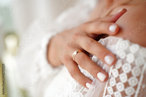 Wedding rings in the hands of the bride and groom. 