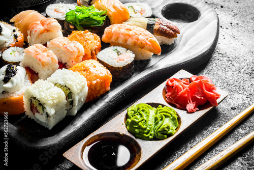 Set of different kinds of sushi rolls with salmon, shrimp and vegetables.
