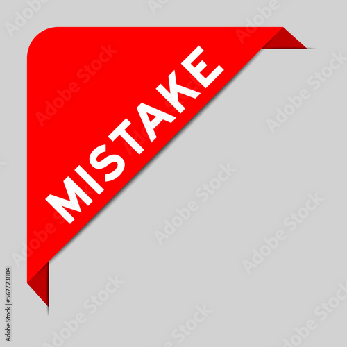 Red color of corner label banner with word mistake on gray background