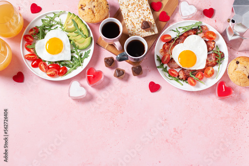 Couple breakfast border on Valentines Day on pink background  top view