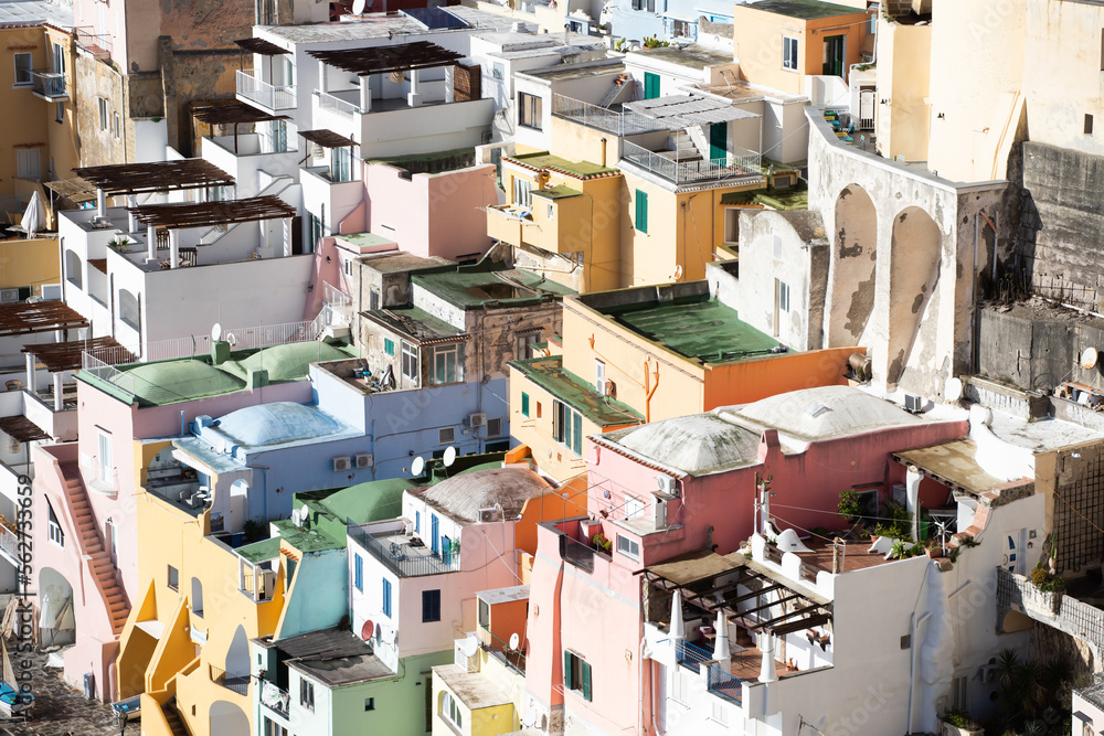 Fototapeta premium Beautiful fishing village with colourful fishermen's houses, Marina Corricella on Procida Island, Bay of Naples, Italy.